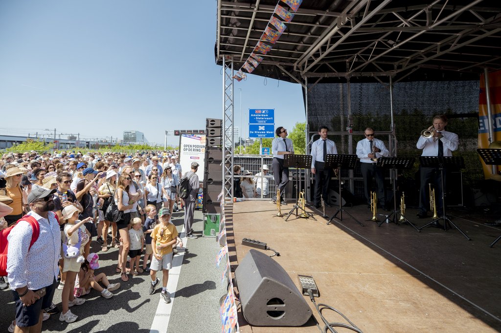 Brass players perform a concert on the A10 ring road