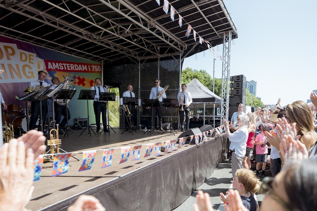 Brass players perform a concert on the A10 ring road