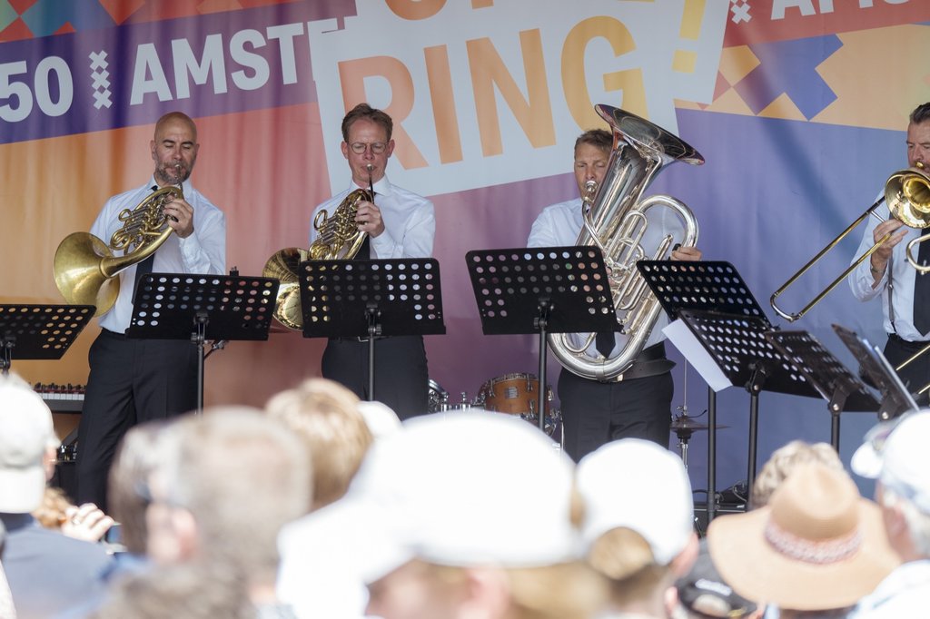 Brass players perform a concert on the A10 ring road